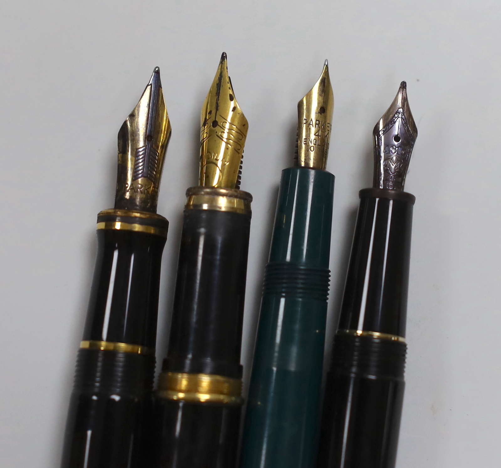 A Mont Blanc fountain pen and three others